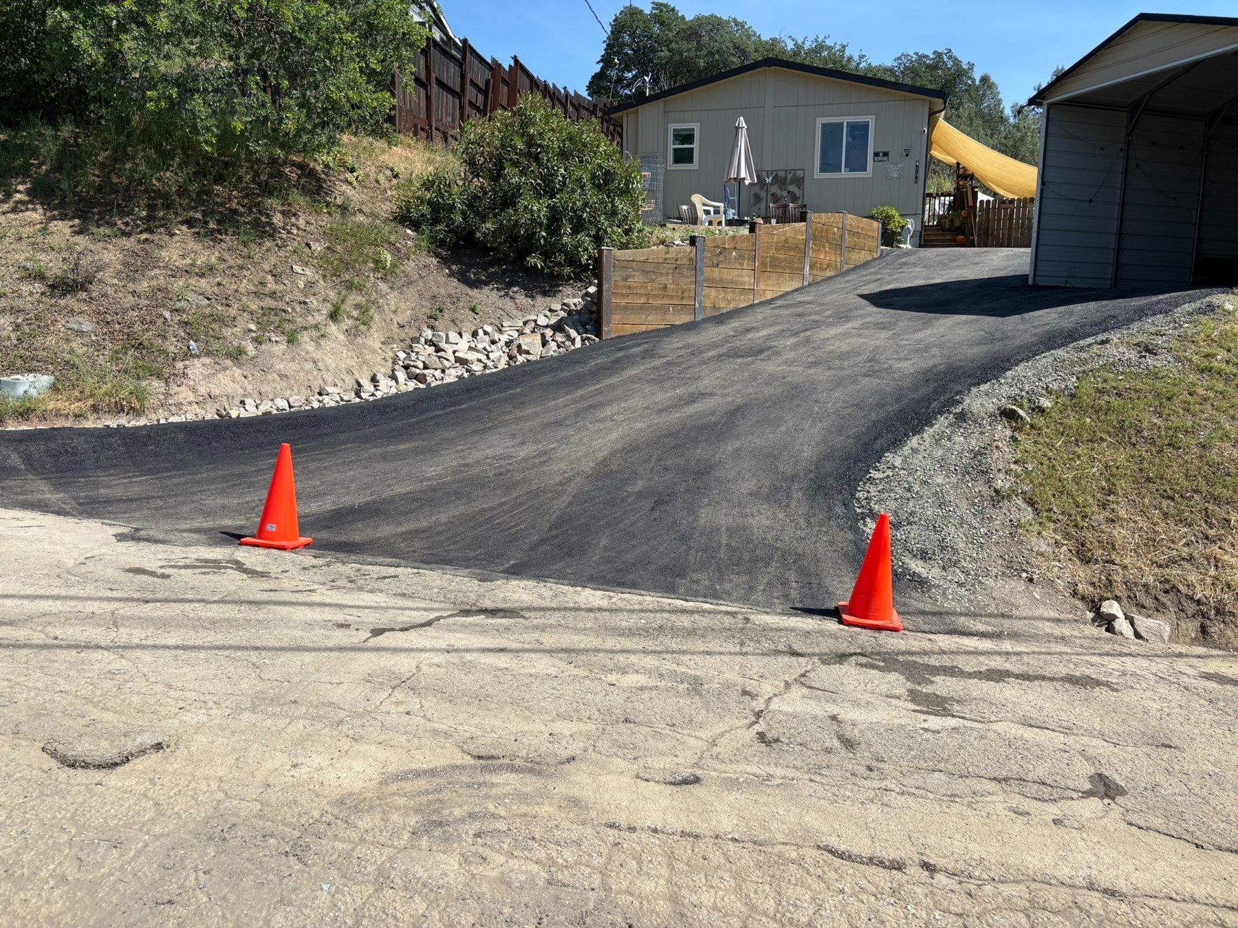 Freshly paved sloping residential driveway